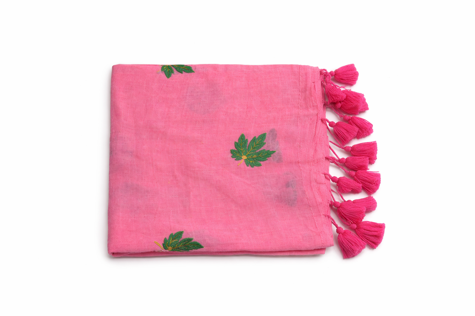 Candy pink Mul cotton saree featuring green leaf embroidery and pink tassels.