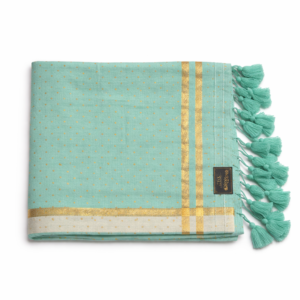 Light green Mul cotton saree with small white heart prints and green tassels.